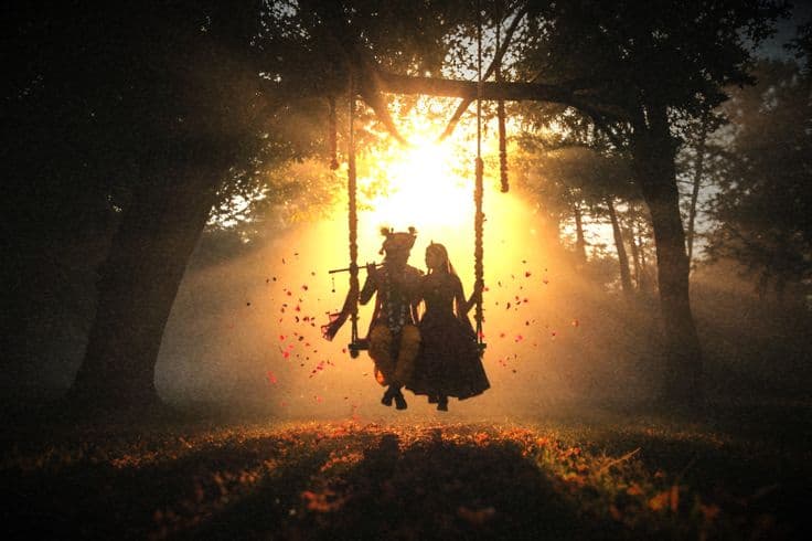 Radha krishna sitting on swing